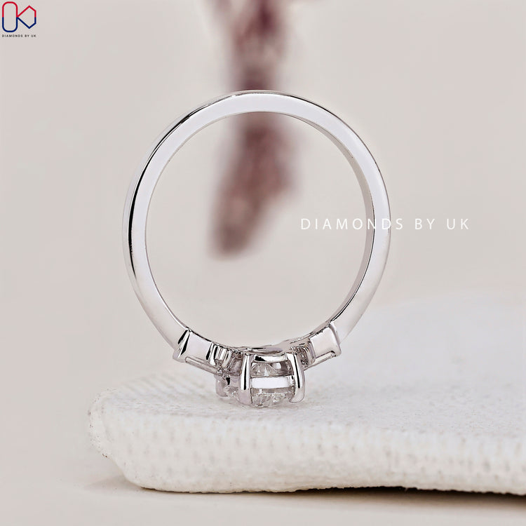 Engagement ring UK with a tear drop diamond and Lab Grown Diamond accents.