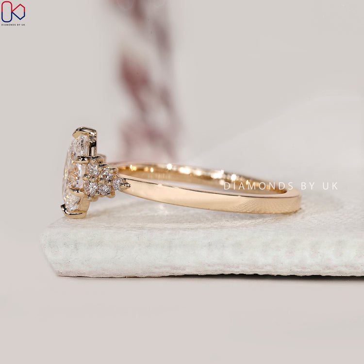 Yellow gold engagement ring with muse inspired design.
