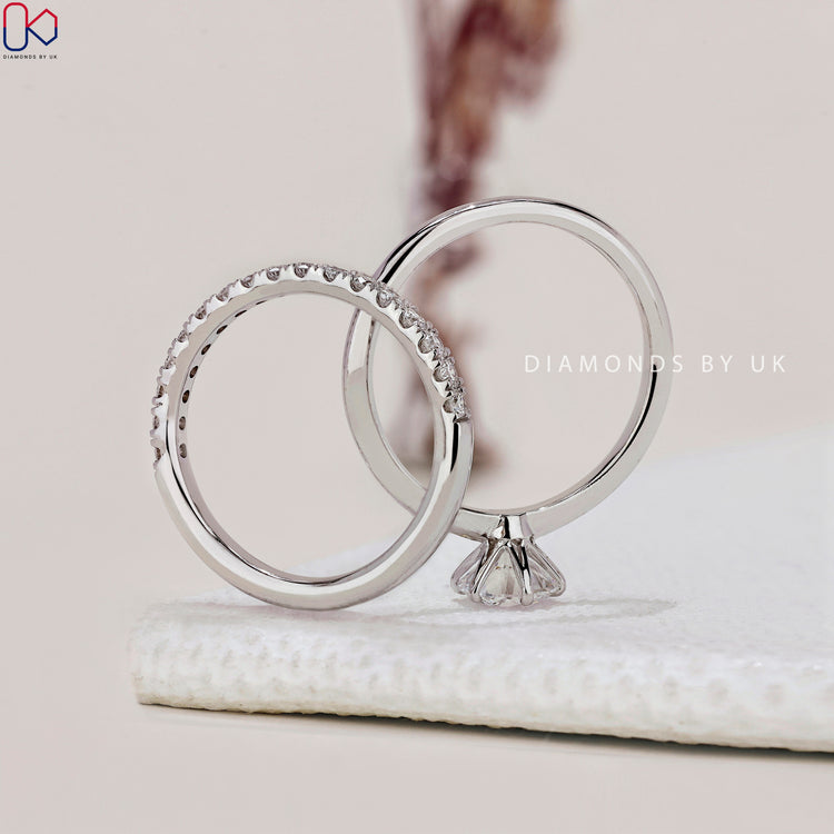 Knife edge shank engagement ring with brilliant diamond detailing.
