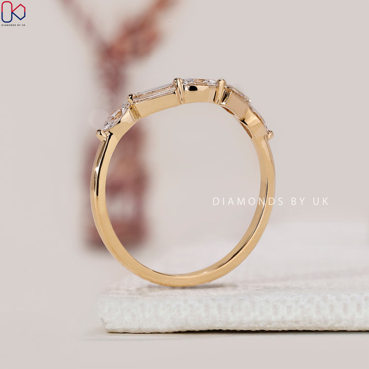 Handmade jewellery with round cut wedding band.
