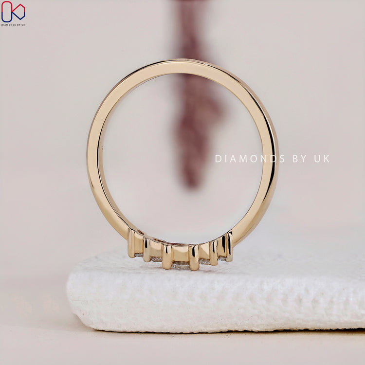 A yellow gold wedding band adorned with lab grown diamonds, IGI certified for quality.
