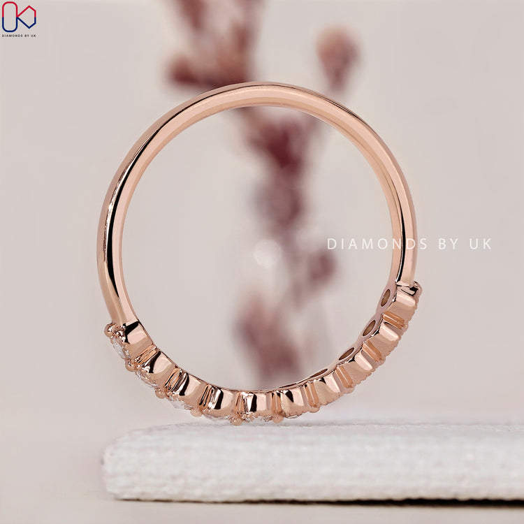 IGI certified rose gold eternity band featuring brilliant round diamonds.
