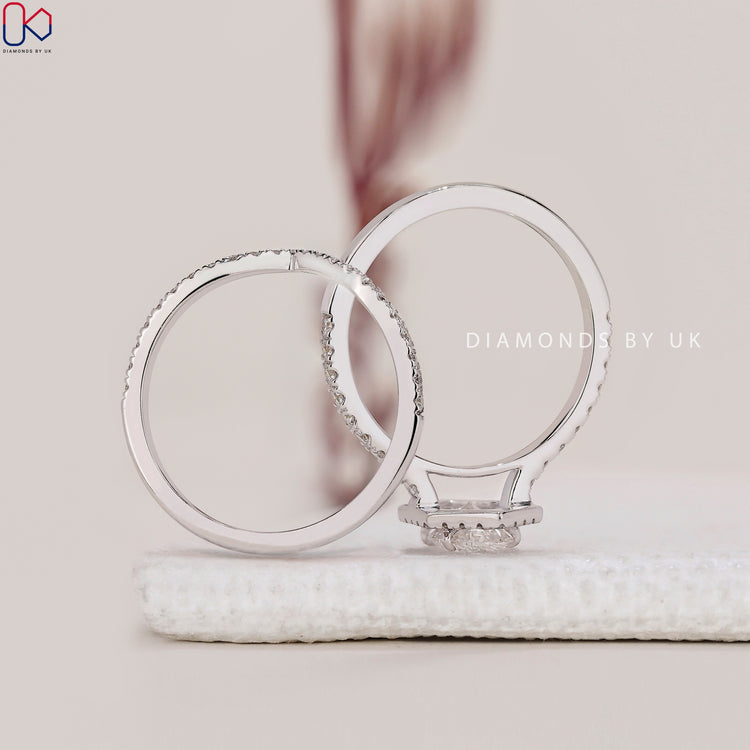Handmade jewellery with halo engagement ring and white gold wedding band.
