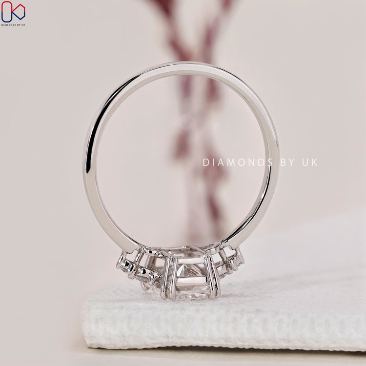 Diamondsbyuk engagement ring with a radiant cut diamond and white gold ring band.