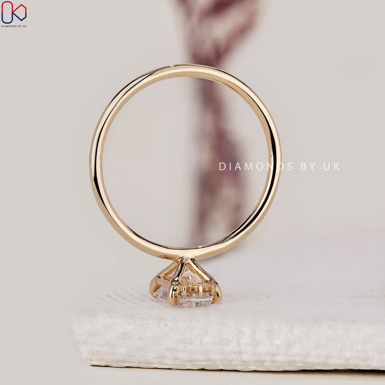 Handmade jewellery with radiant cut diamond in yellow gold setting.
