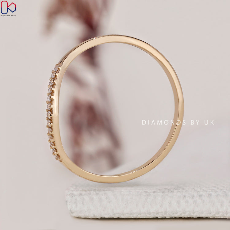 Minimalist wedding band with a simple, elegant design in yellow gold.
