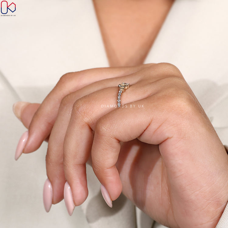 Proposal ring for her designed with a heart-shaped Claddagh and round diamond centre.