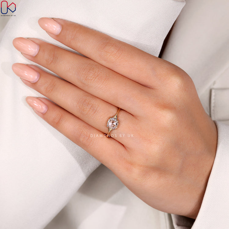 Handmade ring showcasing rose cut solitaire in a 4 prong mount.
