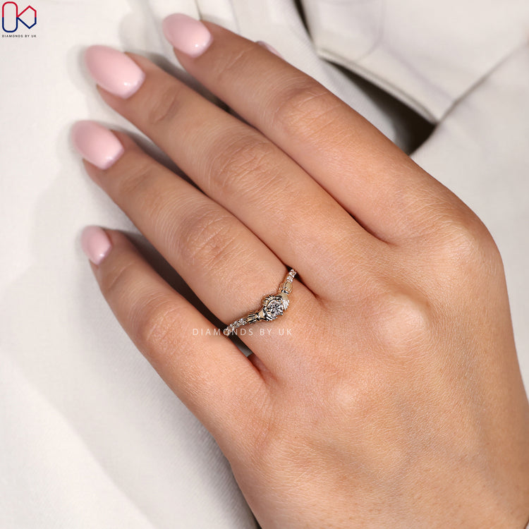 Round diamond engagement ring with Celtic heart and crown details for meaningful symbolism.
