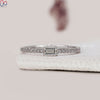 Prong setting wedding band with sparkling round and baguette diamonds.
