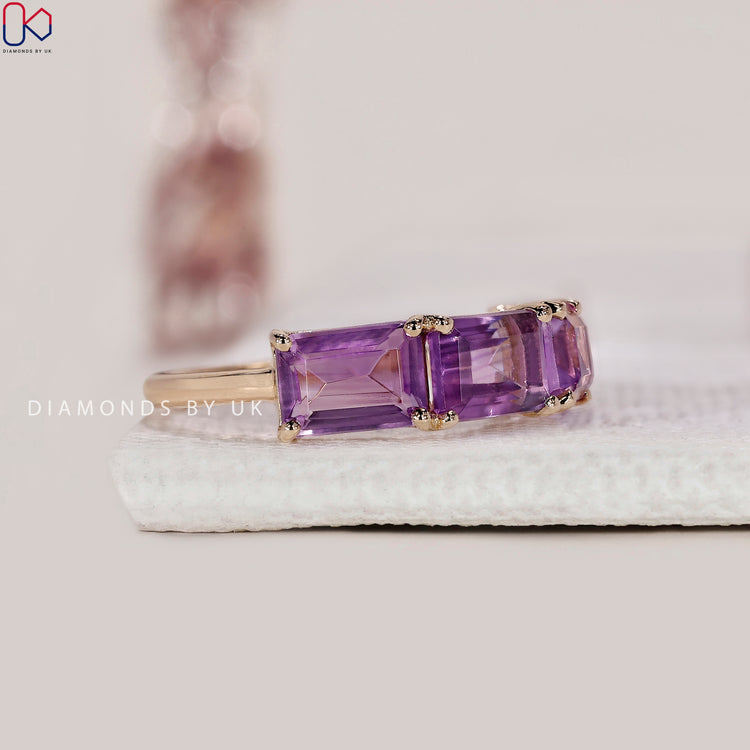 Yellow gold three stone ring with amethyst and diamonds