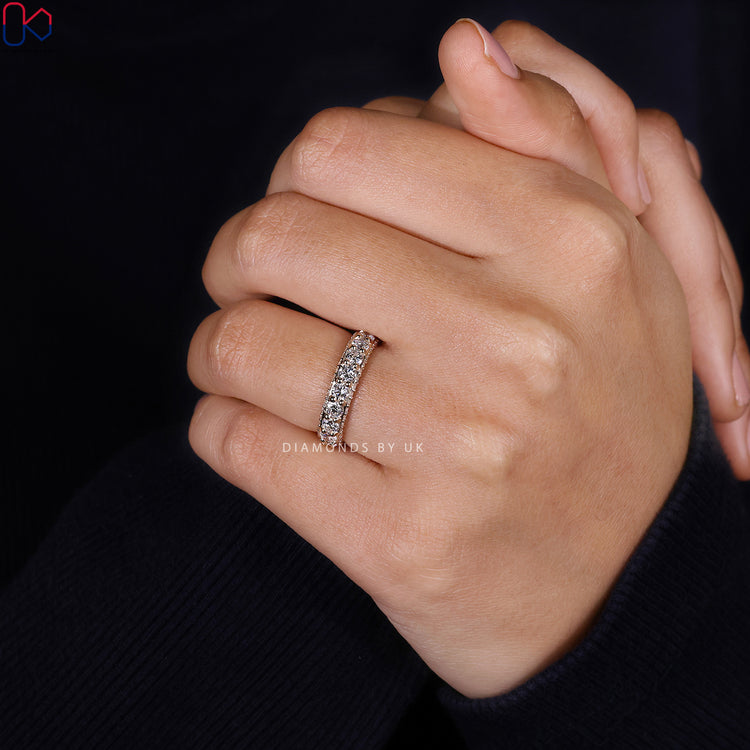 Round cut diamond band with three sided eternity style.

