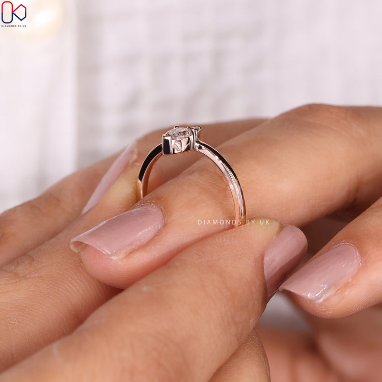 Buy diamond band with pear and round stones in a modern design.
