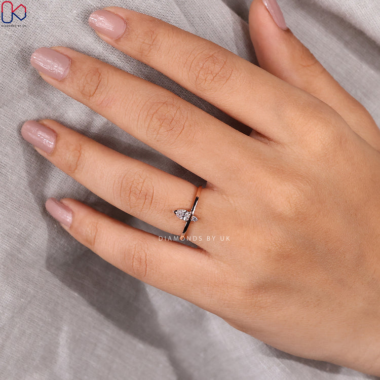 Pear and round wedding band available as a Diamondsbyuk band.
