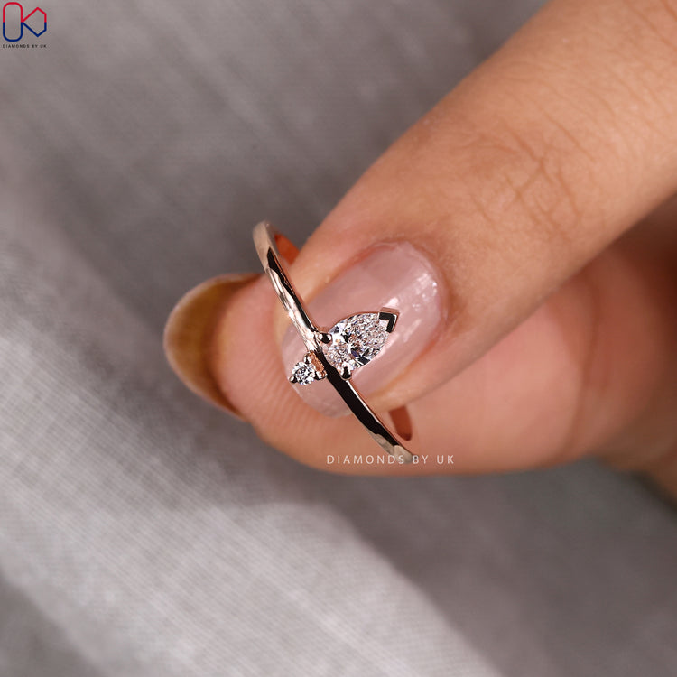 Handmade jewellery showcasing a rose gold V prong setting band.

