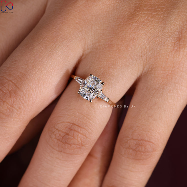 Handmade Ring featuring a cushion cut diamond in yellow gold.
