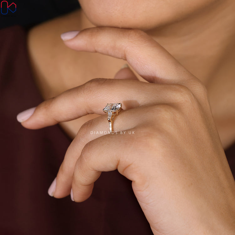 Yellow Gold Ring with a radiant 3 Stone Diamond design.
