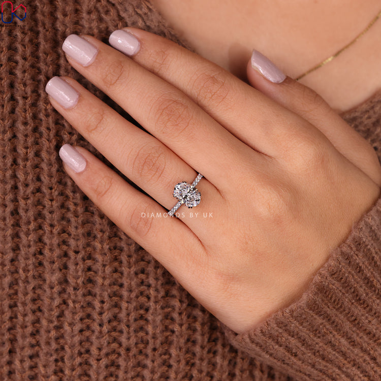 Pave oval diamond ring in white gold setting.

