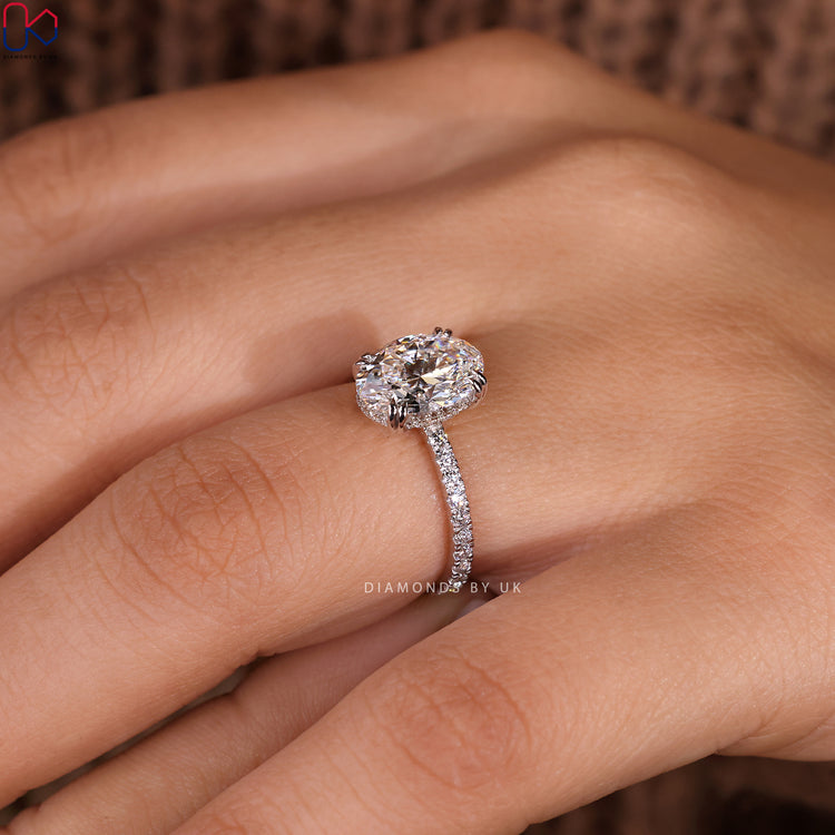 Handmade jewellery with an oval cut diamond in a white gold setting.
