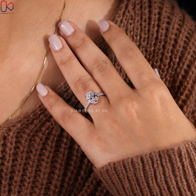Handmade oval cut diamond ring with a white gold band.
