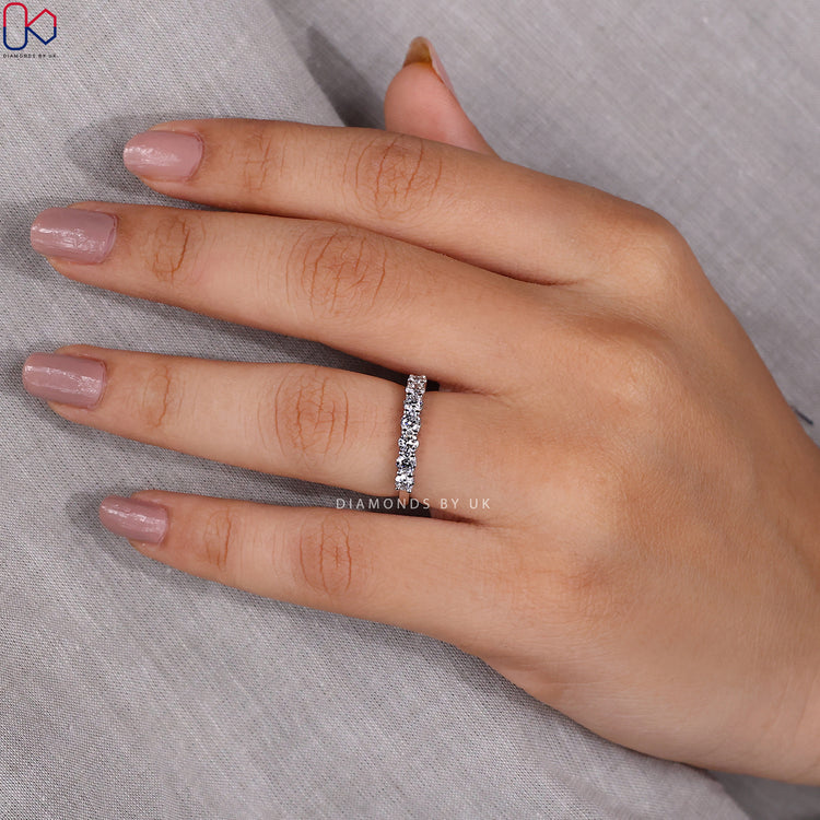 Lab grown diamond band in a seven-stone wedding style.
