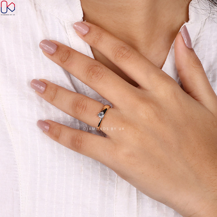 Handmade ring featuring a round brilliant cut diamond in a yellow gold band.