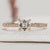Asscher cut ring with round diamond pavé style.