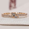 Baguette and round diamond band with bypass setting.
