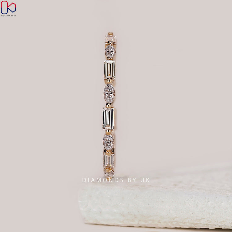 Yellow gold band with intricate design and stunning diamonds.
