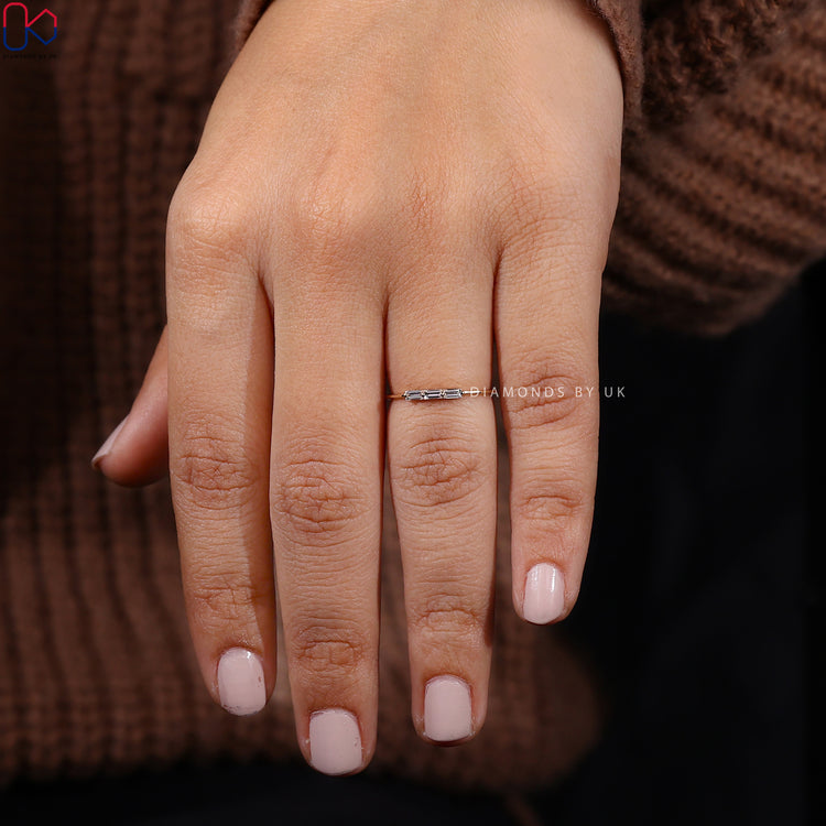 Three stone baguette cut diamond band by Diamondsbyuk.
