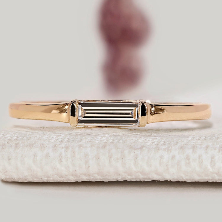 Baguette cut diamond wedding band with solitaire style.