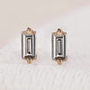 Baguette cut diamond earrings in a stud style.