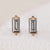 Baguette cut diamond earrings in a stud style.