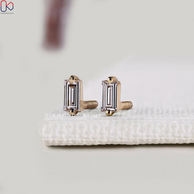 Baguette diamond earrings with a solitaire design.