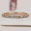 Baguette and round diamond band with bar setting.
