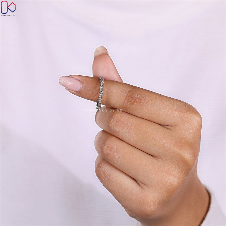 Prong set diamond band with alternating cuts in a custom full eternity circle.

