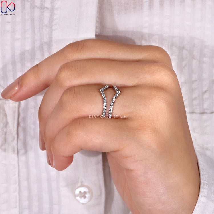 White gold wedding band designed to enhance engagement rings with added sparkle.
