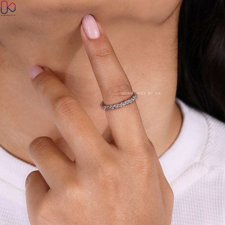 Yellow gold wedding band with marquise and round stones handcrafted by Diamondsbyuk.
