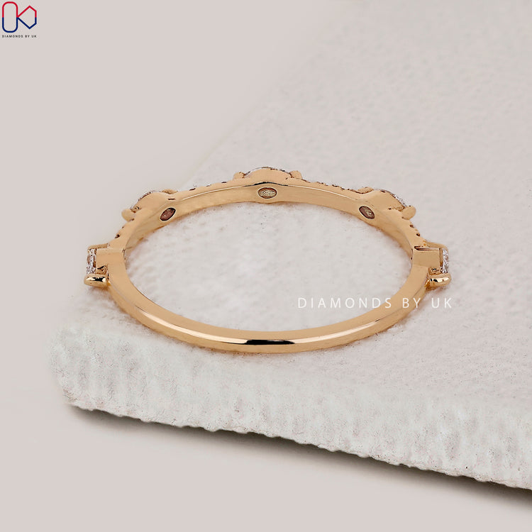 Marquise and round diamond band set in a prong setting for everyday comfort and style.
