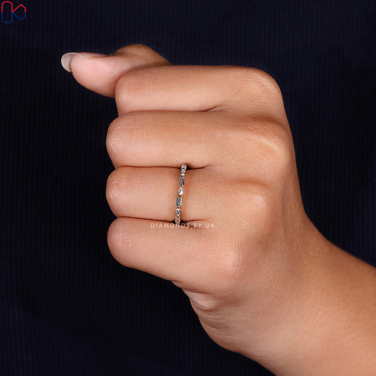 Handmade band featuring marquise and baguette diamonds.
