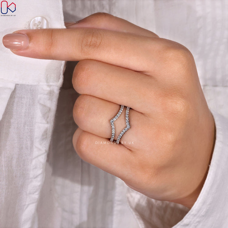 Designer wedding band crafted with clean curves and lab grown stones.
