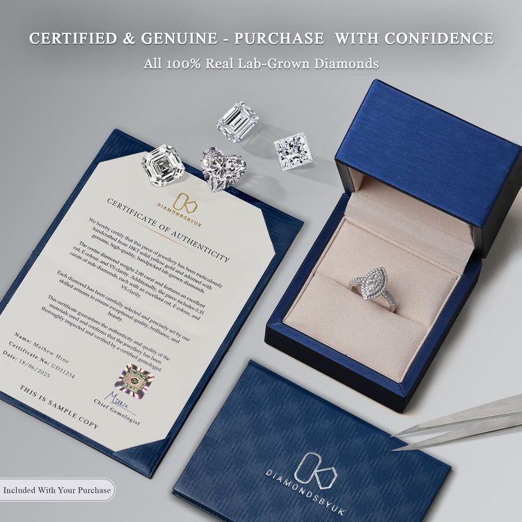 Lab-grown diamond ring in a blue box, displayed with a Certificate of Authenticity, DiamondsByUK cardholder, tweezers, and loose lab-grown diamonds in various cuts.