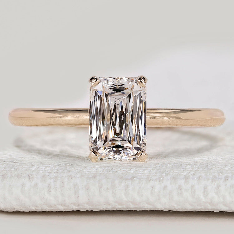 Criss cut solitaire ring with tulip basket setting.
