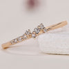 Cluster wedding band with diamond accents and a stunning design.
