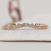 Curved diamond band with round diamonds and half eternity.