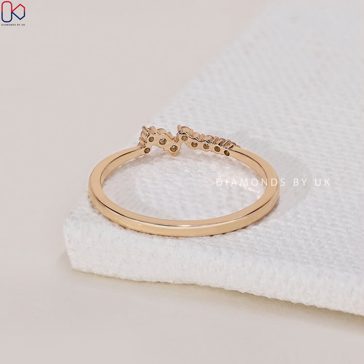 Yellow gold wedding band featuring sparkling diamonds for a classic look.