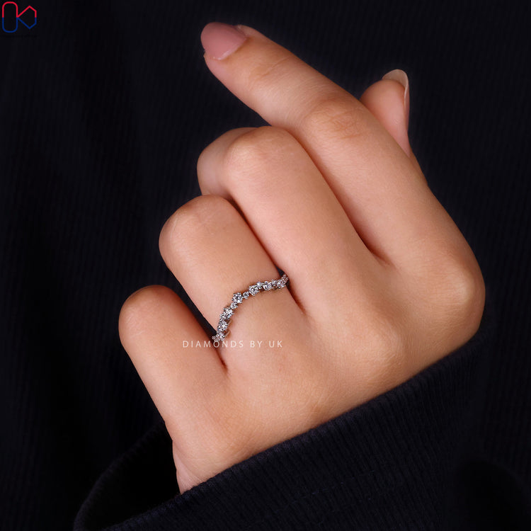 Lab grown diamond wedding band with prong setting.