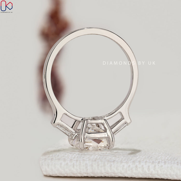 IGI certified cushion diamond ring with four claw setting.
