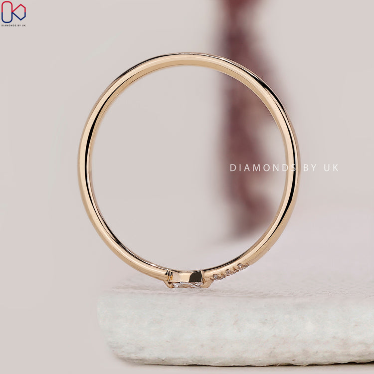 Marquise and round diamond wedding band with lab grown diamonds in a custom form.
