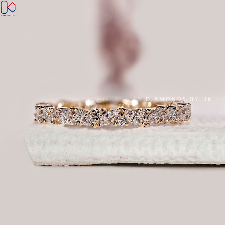 Full eternity diamond wedding band featuring alternating marquise and round lab grown stones.
